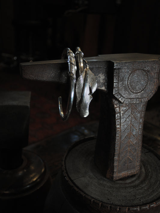 2 sterling silver feather cuffs made using traditional repousse and chasing techniques