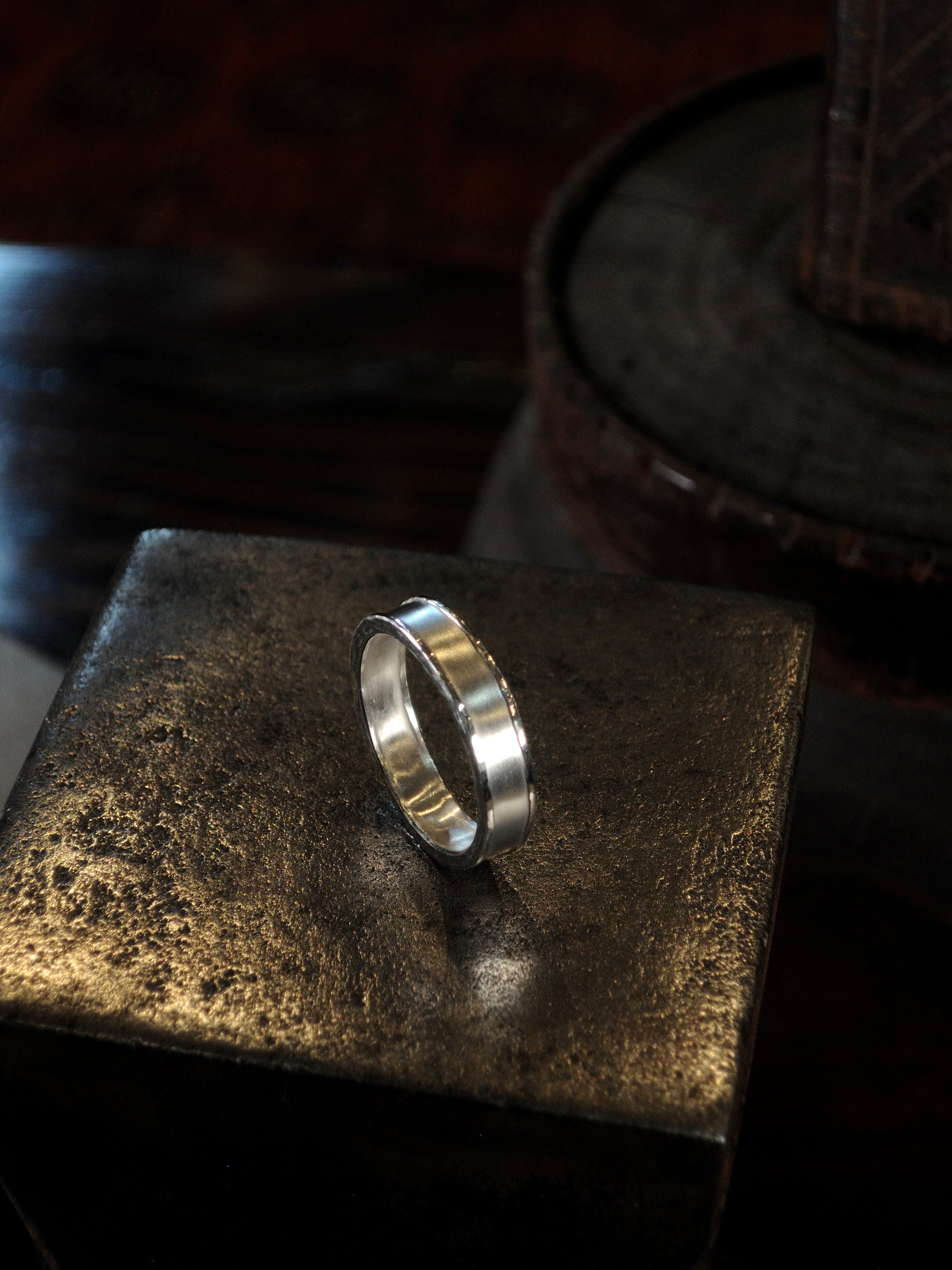 Hammer textured ring featuring hand forged border in sterling silver.