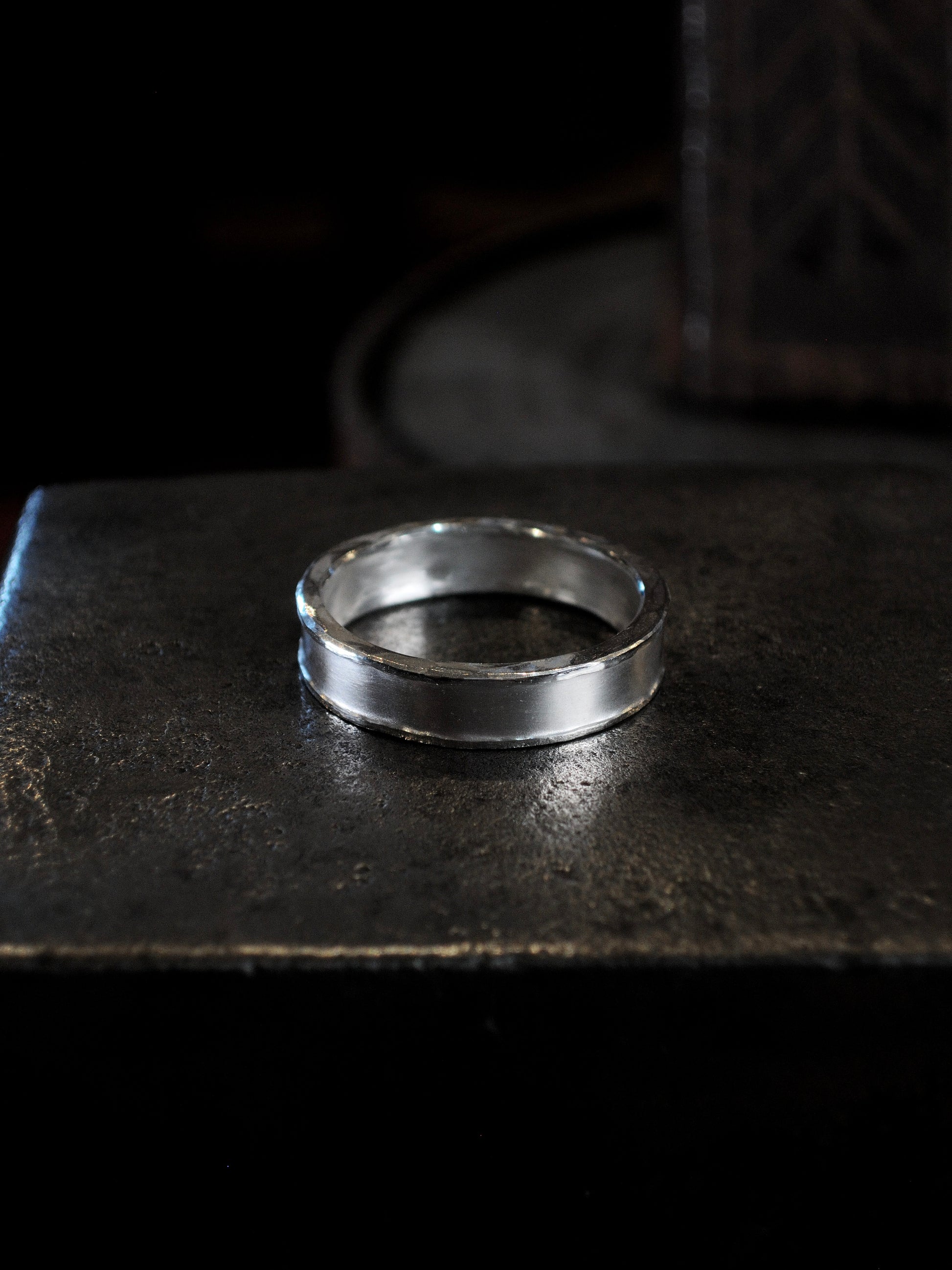 Hammer textured ring featuring hand forged border in sterling silver.