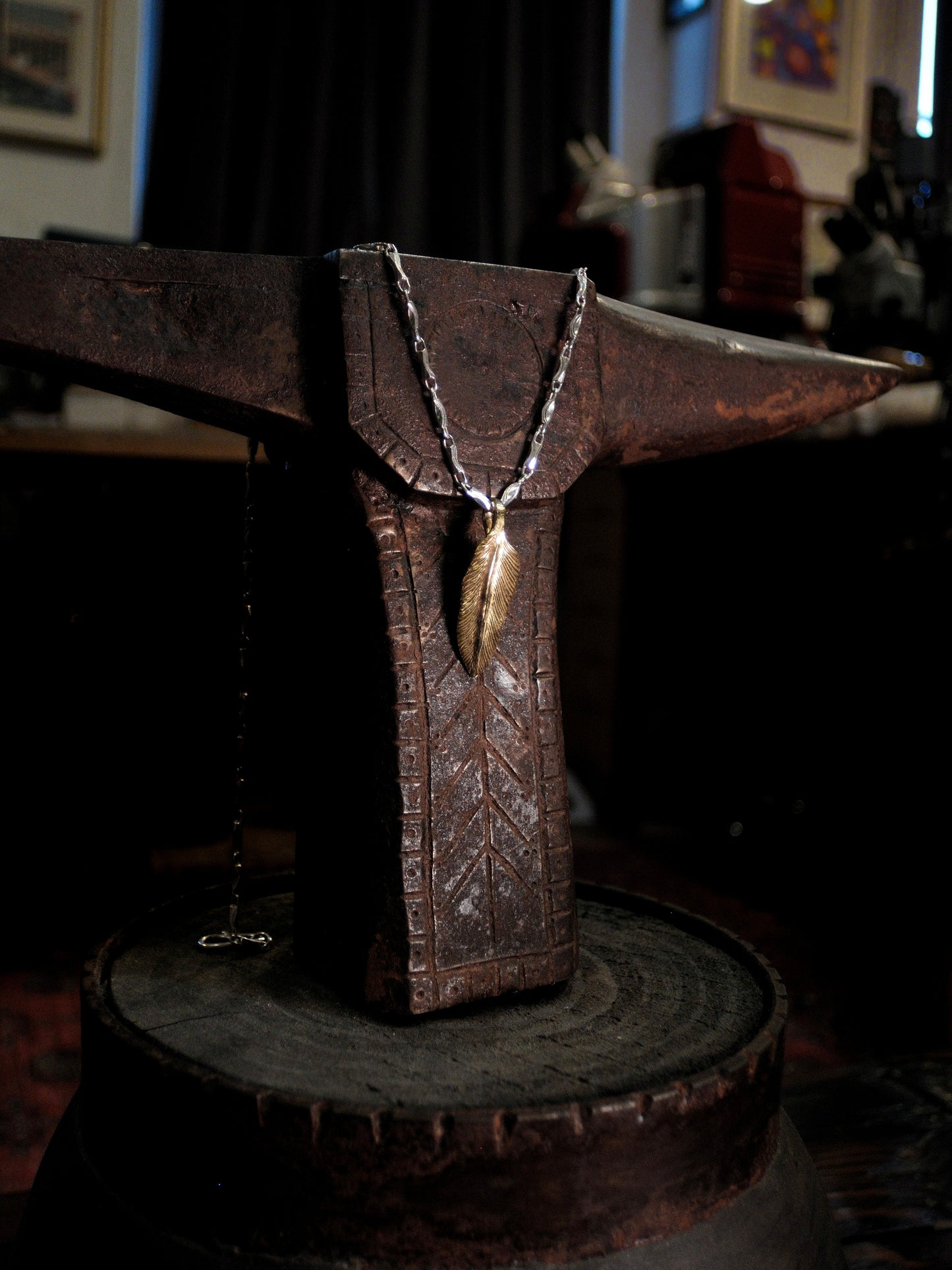 A 22k gold feather charm made using traditional repousse and chasing techniques. 