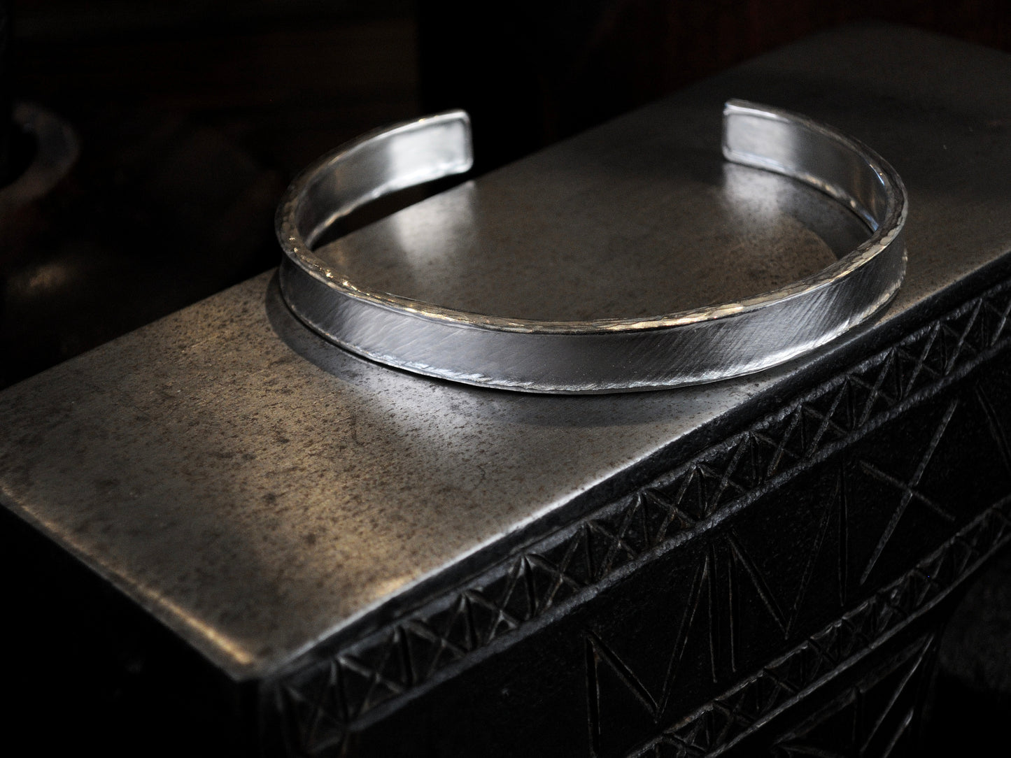 Hammer textured cuff featuring water-like texture and hand forged border in sterling silver.