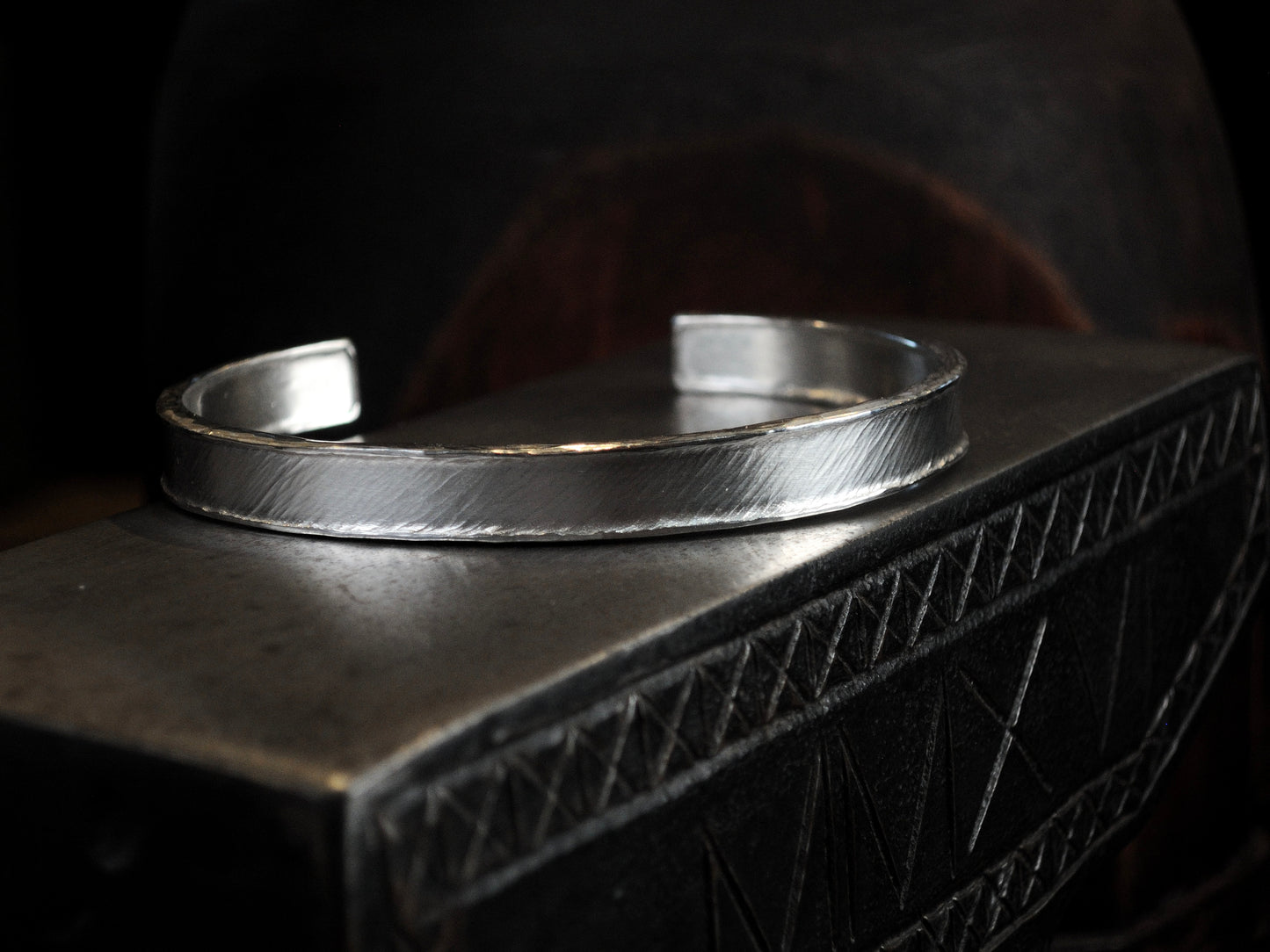 Hammer textured cuff featuring water-like texture and hand forged border in sterling silver.