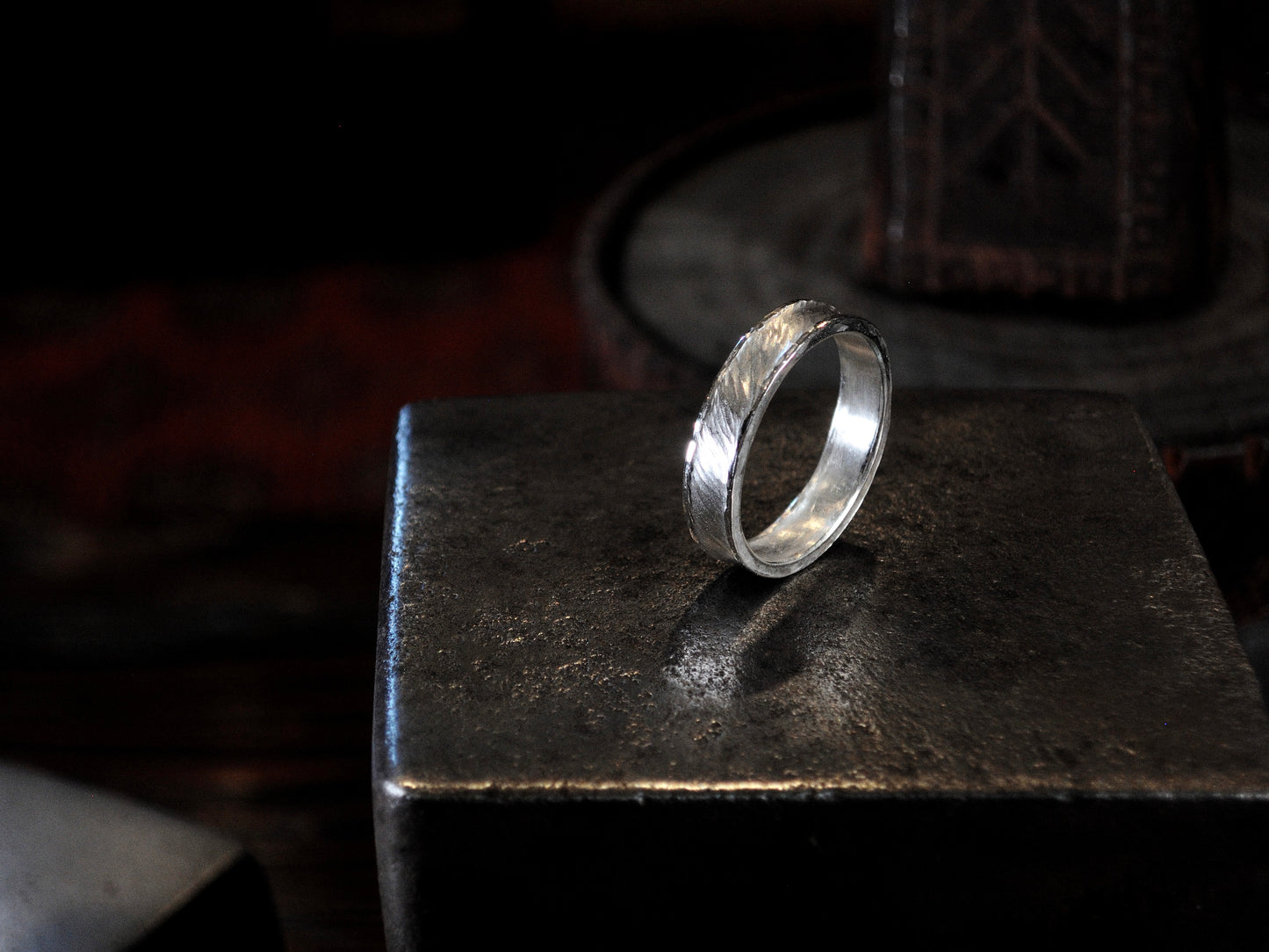 Hammer textured ring featuring water-like texture and hand forged border in sterling silver.