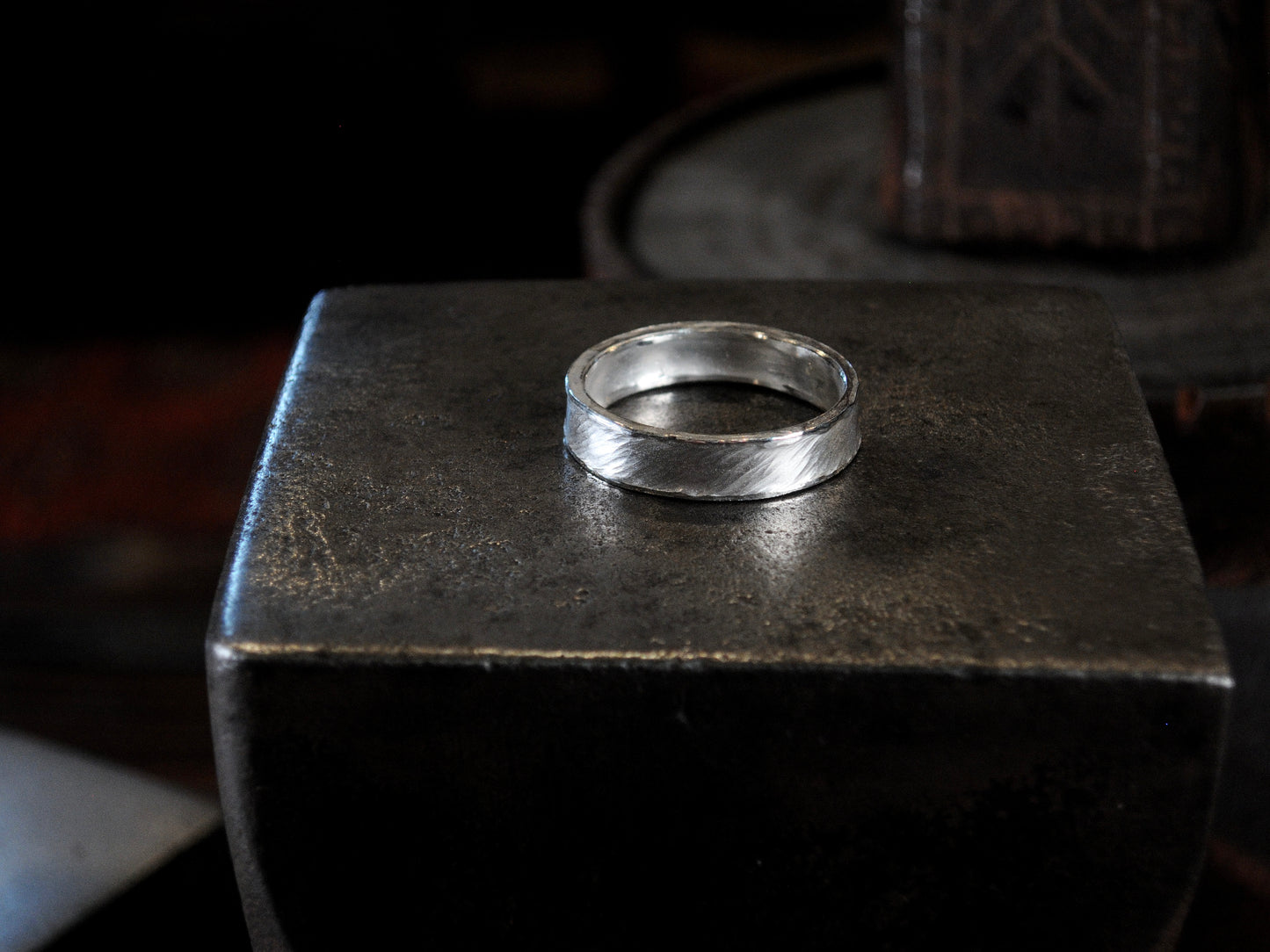 Hammer textured ring featuring water-like texture and hand forged border in sterling silver.