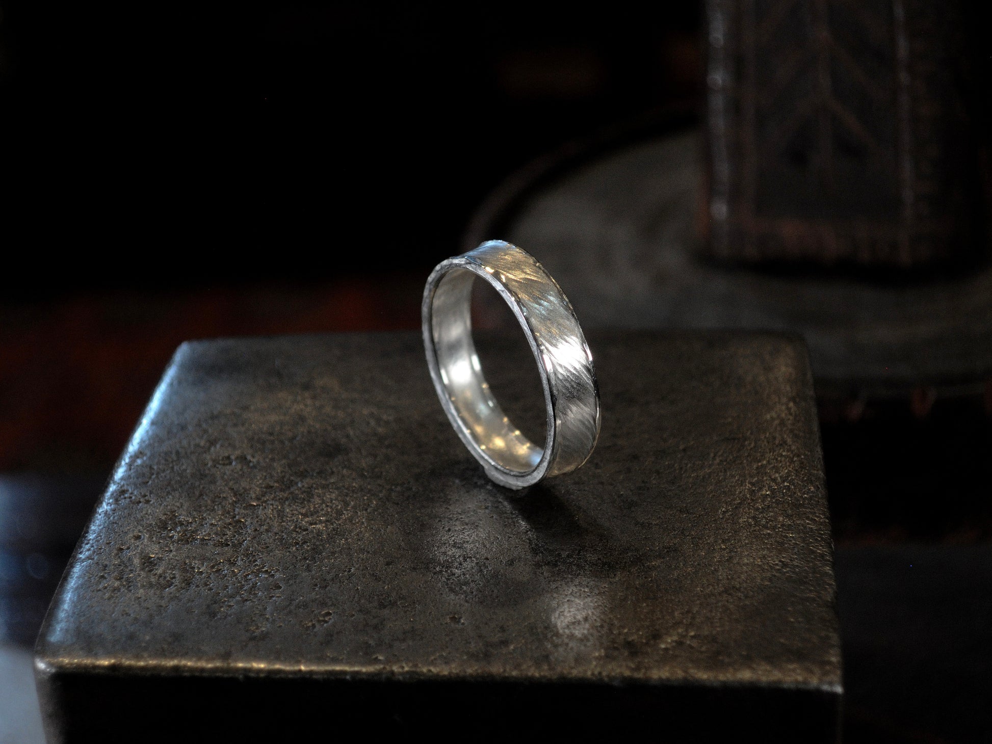 Hammer textured ring featuring water-like texture and hand forged border in sterling silver.